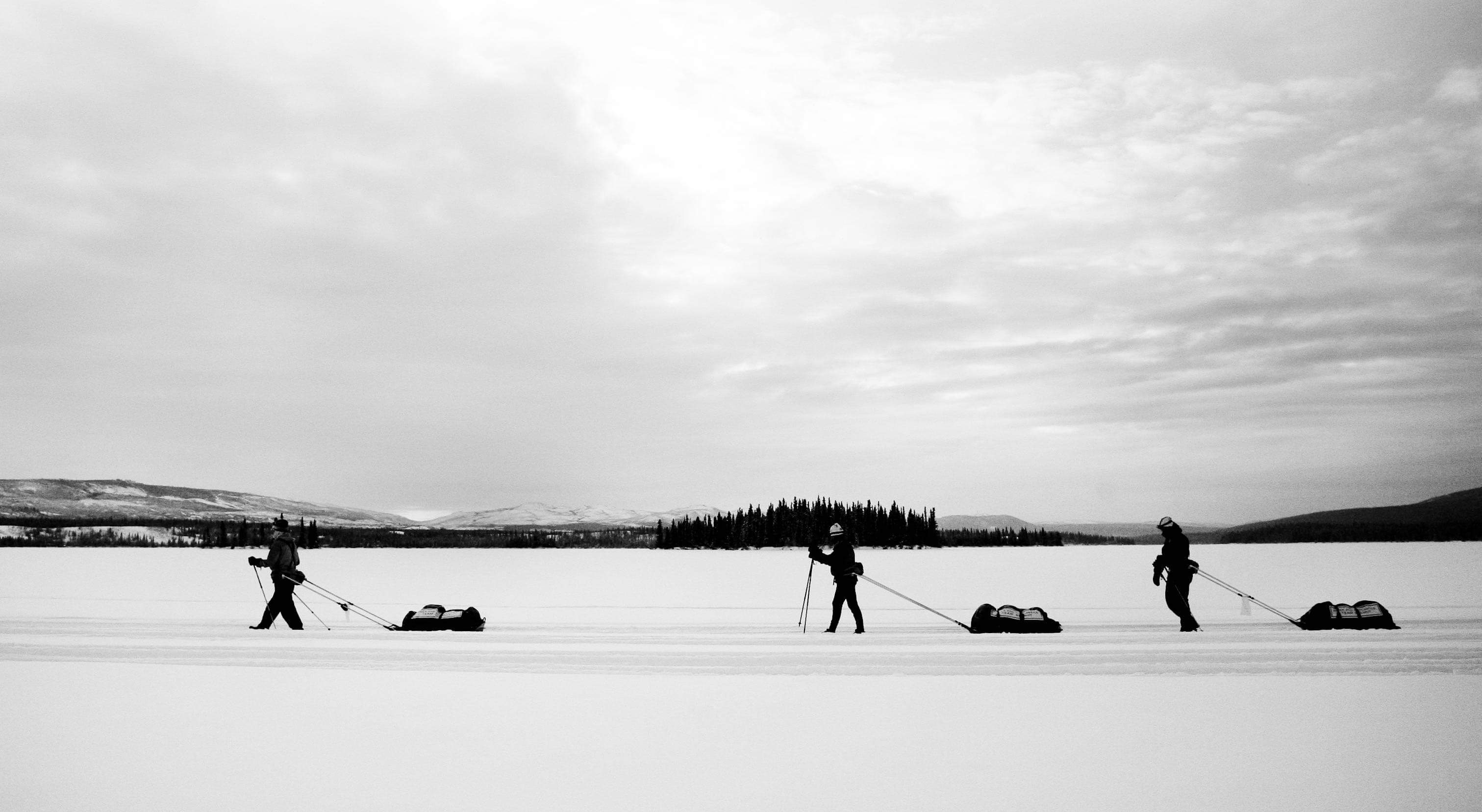 Team Helmut crossing a frozen lake during the 2009 Yukon Arctic Ultra.